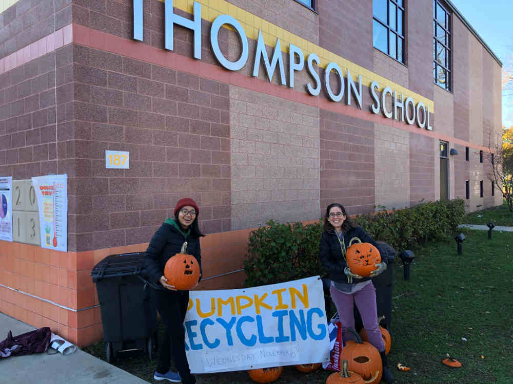 Helpers in front of Thompson school during pumpkin recycling