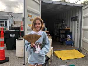 Swap Shed girl holding fan