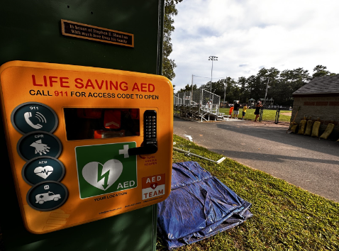 AED behind dugout at Buck Field. 