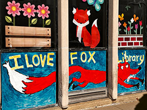 Front of the Fox Library with a painting of a fox on the window and the words 